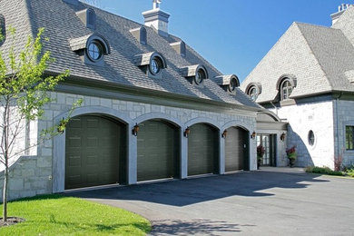 Medium sized attached garage in Other with four or more cars.