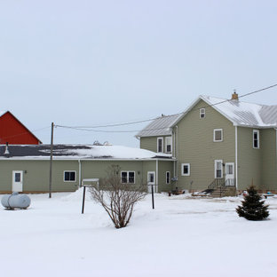Example of a large farmhouse garage design in Other