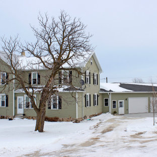 Example of a large farmhouse garage design in Other