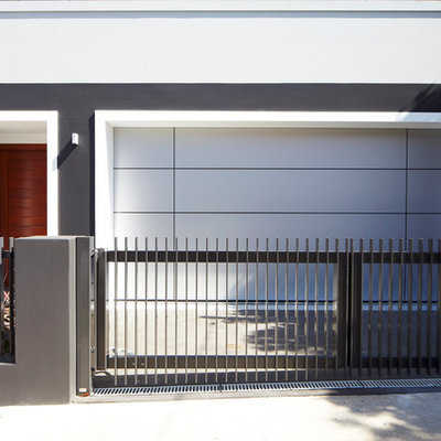 Garage - small contemporary attached two-car garage idea in Sydney