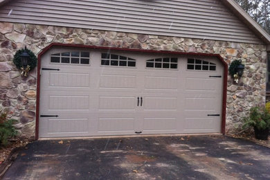 Example of a mid-sized mountain style attached two-car garage design in Philadelphia