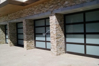 Garage - huge traditional attached four-car garage idea in Orange County