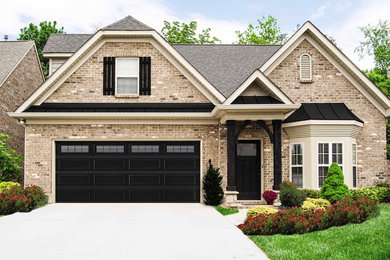 Example of a classic attached two-car garage design in Dallas