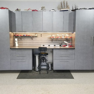 Inspiration for a large industrial attached two-car garage workshop remodel in Atlanta