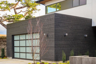 Garage - contemporary attached garage idea in Seattle