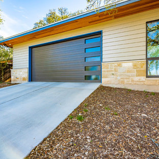Garage workshop - large traditional attached two-car garage workshop idea in Austin