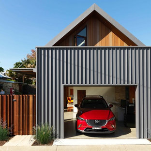 This is an example of a contemporary attached one-car garage in Sydney.