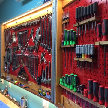 Wall Control Red Metal Pegboard Built Into Folding Cabinet Doors