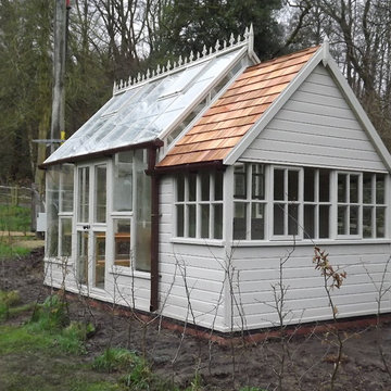 A large greenhouse and separate potting shed