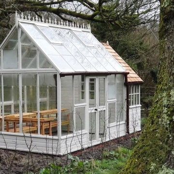 A large greenhouse and separate potting shed