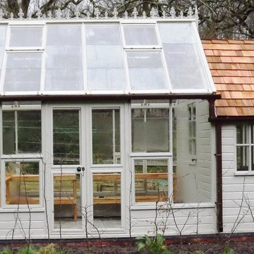 A large greenhouse and separate potting shed