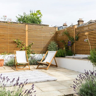 Photo of a mid-sized transitional detached garden shed in London.