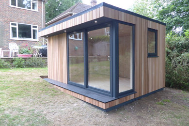 This is an example of a medium sized modern detached office/studio/workshop in Other.
