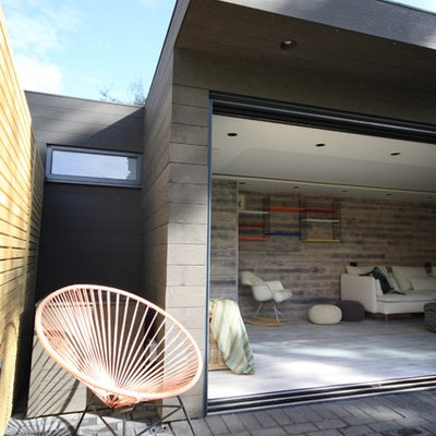 Inspiration for a mid-sized contemporary detached studio / workshop shed remodel in Surrey