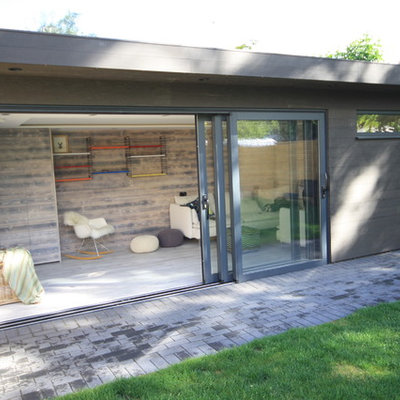 Inspiration for a mid-sized contemporary detached studio / workshop shed remodel in Surrey