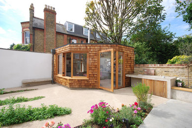 Photo of a small contemporary garden shed and building in London.