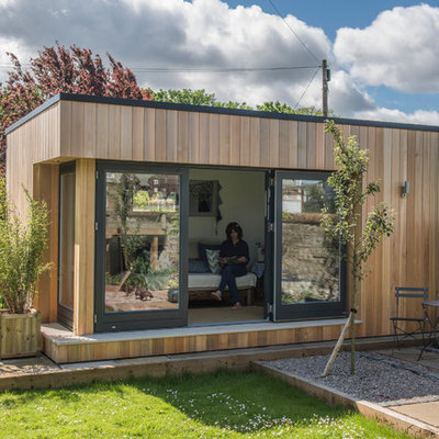 Example of a trendy detached guesthouse design in Other