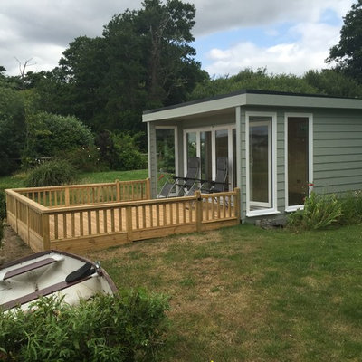 Example of a mid-sized trendy detached studio / workshop shed design in Dorset