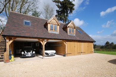 Inspiration for a large rural detached garage in Surrey.