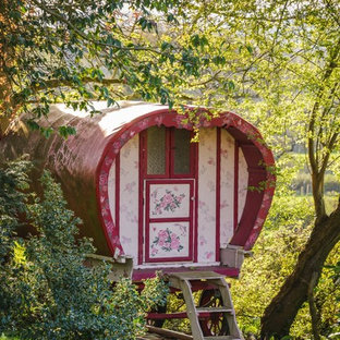 Shabby-chic style detached garden shed and building in Other.