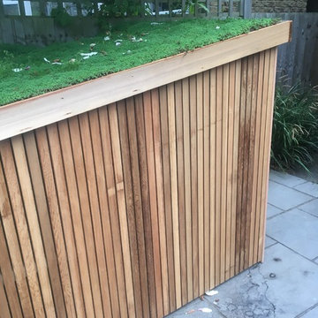 Slot in bike shed with living roof