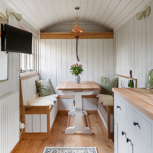 Example of a small cottage chic guesthouse design in Other