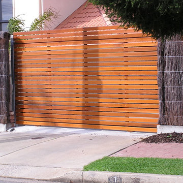 65mm horizontal Western Red Cedar battens - sliding, automated gate.