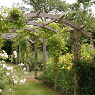 Design ideas for a classic formal garden in Sussex with a garden path.