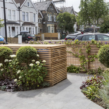 A modern, enclosed front garden driveway