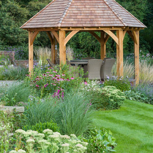 Photo of a medium sized country back full sun garden for summer in Cheshire with natural stone paving.