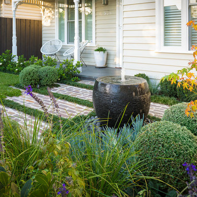 This is an example of a small front yard stone water fountain landscape in Melbourne.