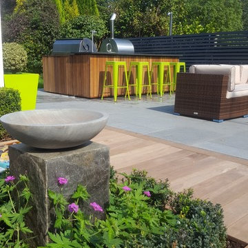 Bird Bath feature with outdoor bar in background