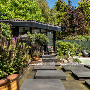 Inspiration for a world-inspired back formal full sun garden in Hertfordshire with a garden path and concrete paving.