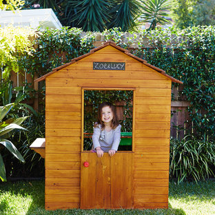 Photo of a mid-sized contemporary backyard garden in Sydney with with outdoor playset.