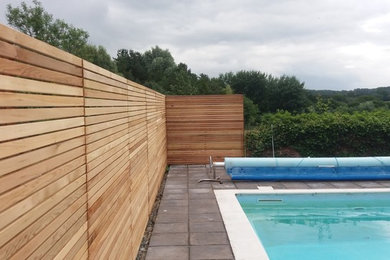 Cedar fence enclosing swimming pool