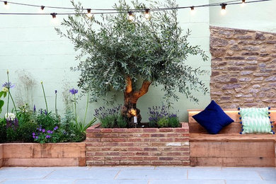 Photo of a small rustic courtyard partial sun garden for autumn in Other with natural stone paving.