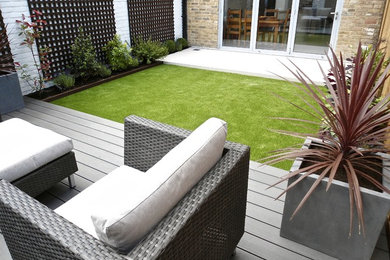 This is an example of a contemporary garden in Other with decking.