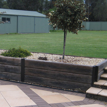 Contemporary garden retaining wall with steps