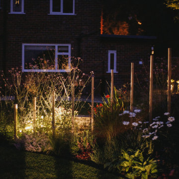 Contemporary Rural Garden with a View - lighting on the cedar screen
