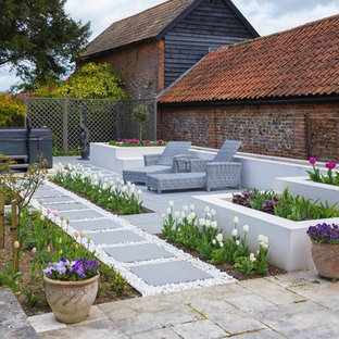 Photo of a medium sized contemporary back formal garden in Other with a garden path and concrete paving.