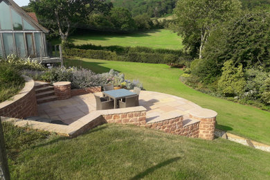 Inspiration for a medium sized country back full sun garden for summer in Other with natural stone paving.