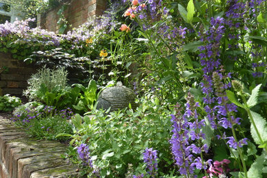 Design ideas for a classic courtyard garden for summer in Sussex.