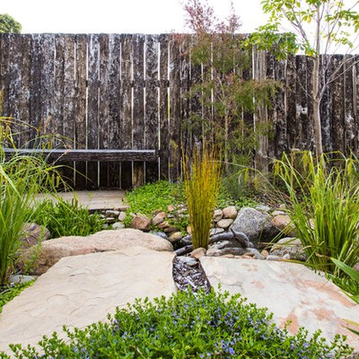 Design ideas for a small front yard stone pond in Melbourne.