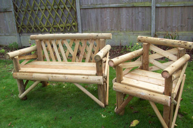 Photo of a medium sized rustic back formal garden for spring in Kent.