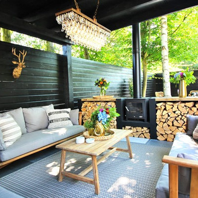Photo of a mid-sized eclectic landscaping in Kent with decking.