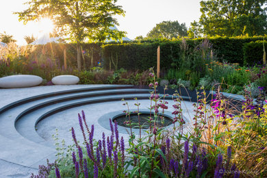 Photo of a large contemporary back full sun garden for summer in London.