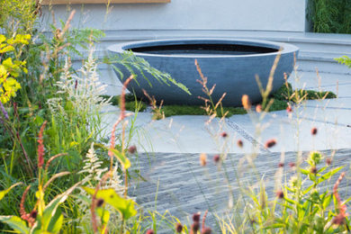 Design ideas for a medium sized contemporary back formal partial sun garden for summer in London.