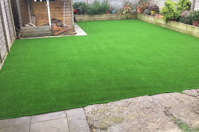This is an example of a medium sized contemporary back garden in Kent.