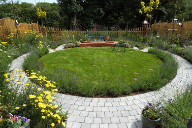 Design ideas for a rural back formal garden in Oxfordshire with a garden path and concrete paving.