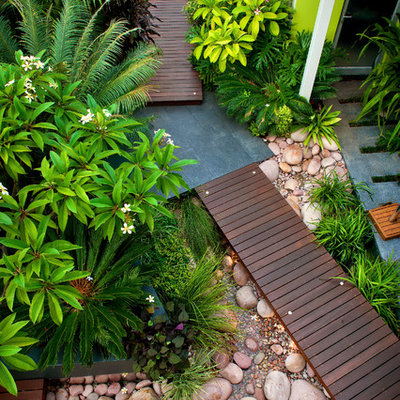 Inspiration for a small contemporary front yard water fountain landscape in Perth with decking.